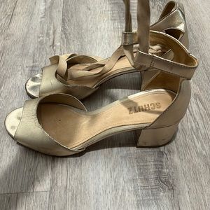 Schutz brand, gold, lace up sandals.